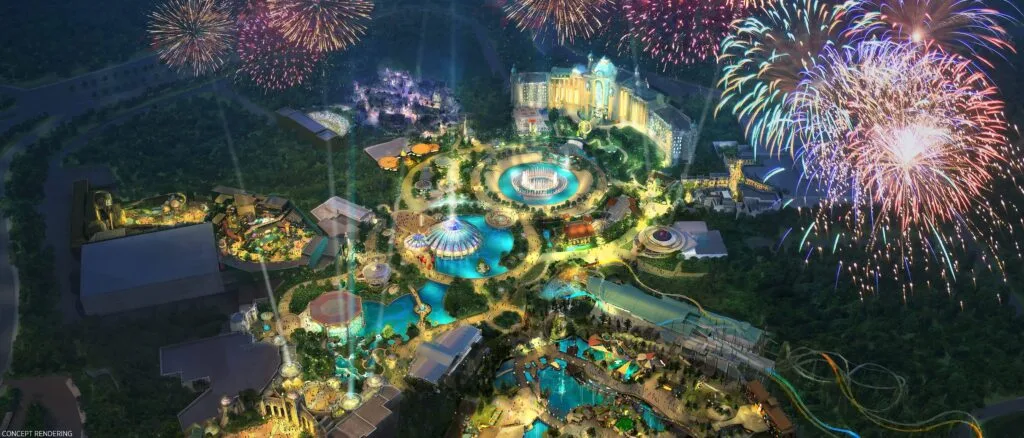 Entrada iluminada do Epic Universe em Orlando à noite com portais temáticos